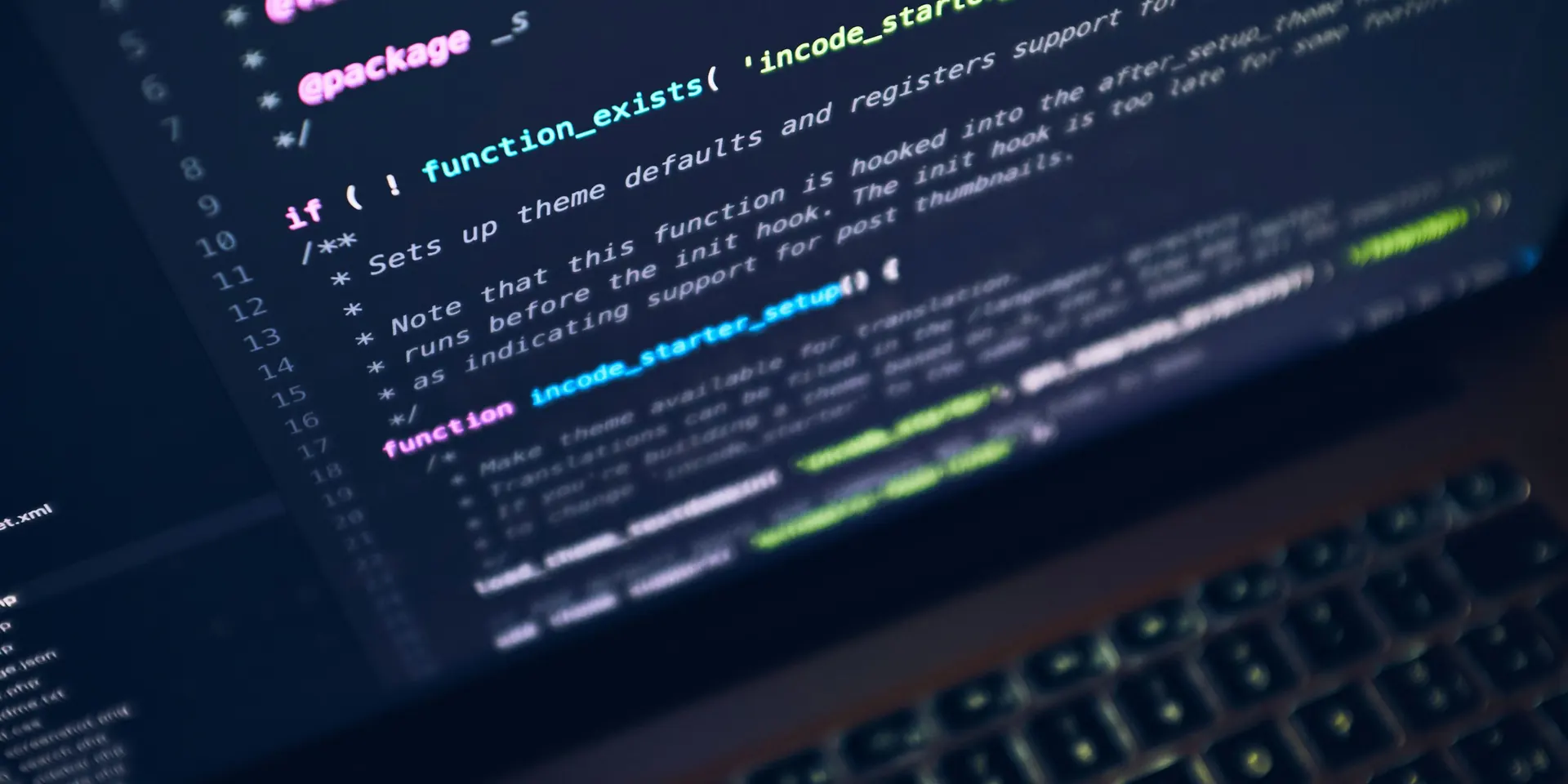 WordPress theme code on a laptop screen